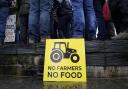 Members of the farming community protest outside the Senedd in Cardiff over planned changes to farming subsidies.