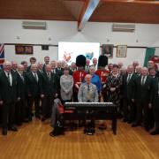 The Mayor of Pembroke, Councillor Aden Brinn, with Welsh Guardsmen and the musical team and choristers following the Pembroke and District Male Voice concert at Pembroke Town Hall.