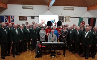 The Mayor of Pembroke, Councillor Aden Brinn, with Welsh Guardsmen and the musical team and choristers following the Pembroke and District Male Voice concert at Pembroke Town Hall.