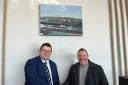 Adrian Andrews and Alan Rees-Baynes with one of the paintings at Dulse @Ty Hotel on Milford Waterfront