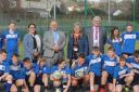 Pembrokeshire County Council leader David Simpson, Councillor Sam Skyrme-Blackhall, Greenhill School head David Haynes and pupils are pictured at the announcement of the new pitch.