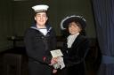 Liam Murphy receives his Young Persons Award from the High Sheriff of Dyfed, Mrs R E Jones.