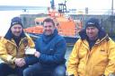 Pictured, from left: Fishguard RNLI Coxswain Paul Butler, Mark Bean and Fishguard RNLI Assistant Mechanic Colin Dunn. PICTURE: RNLI/Fishguard
