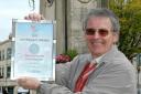 Malcolm Tarling, chairman of Stroud in Bloom, with the Heart of England in Bloom silver gilt award