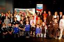 The Pembrokeshire Sport award winners and finalists proudly pose on the Follies Theatre stage.
