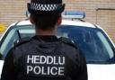 A man threatened to spit in a female police officer's face at Haverfordwest Police Station.