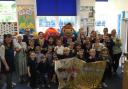 Staff and pupils celebrate their amazing achievement after being awarded the prestigious Language Charter Gold Award