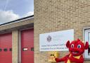 Sbarc the mascot with the ldefibrillator installed at Carmarthen fire station