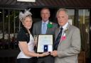 Terry Clarke receives his silver medal from this year’s Radnor President, Mrs Rhian Duggan and husband John. (9096828)