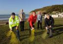 PENDINE PATROL: Highlighting dog fouling hotspots near the seafront are Carmarthenshire County Council's Tidy Towns officer, Brian Mogford; Councillor Jim Jones; Daniel Snaith, Keep Wales Tidy; Pendine Community Council chairman, Peter Bowering and