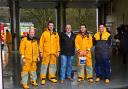 Cllr Wynne Evans is pictured with Tenby lifeboat crew members after making his donation