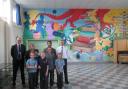 Pictured with the new Tavernspite School mural are governors' chair Nick Davies, Dr Faiz Ali and Dr Taher Ali, artist Martina Morgan, headteacher Kevin Phelps and pupils Ruben, Saski and Nia-Anne Morgan and Haroon Ali..
