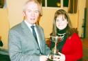 Best speaker Jessica Robinson, of Clynderwen YFC, receives her trophy from Pembrokeshire YFC president Stephen James.