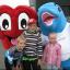 Hearty from the British Heart Foundation meets Finn the dolphin from Bluestone and children watching the start of the Pembrokeshire County Run.