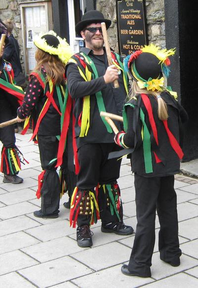 The morris dancers of Heb Enw at the official opening of the 2011 Fishguard Folk Festival outside the Royal Oak pub in the centre of town. 