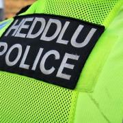A teenager admitted assaulting three police officers in Haverfordwest.