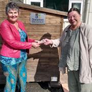 Gwenno hands over the money saved during her jubilee protest fast to Lesley Matthews of the Pembrokeshire Community Food Pod. Picture: Western Telegraph