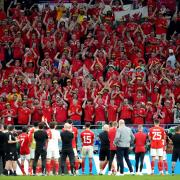 Wales' players applaud their supporters