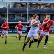 Jess Breach races away to score for England against Wales.