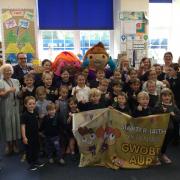 Staff and pupils celebrate their amazing achievement after being awarded the prestigious Language Charter Gold Award