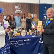 Show president Brian Jones MBE and his wife Helen are pictured in the Food Hall sponsored by Mr Jones' company, Castell Howell.