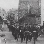 The original procession 100 years ago.