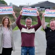 Maria, Sean and Alan with their People's Postcode Lottery winnings.