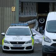 Police at the scene of the suspected cannabis farm at Honeyborough industrial estate Neyland