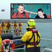 The rugby ball is thrown from Angle to St Davids lifeboats, ahead of the match in memory of Gareth and Daniel Willington (inset).