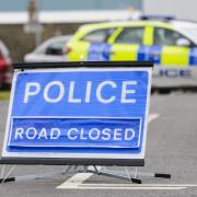 The A487 was closed after the two-car crash
