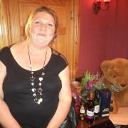 CHARITY NIGHT: Sharon poses in front of the raffle prizes