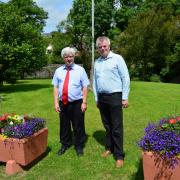 Wales in Bloom judge John Woods is pictured with the Rev Geoffrey Eynon at last year's judging.PICTURE: Western Telegraph.