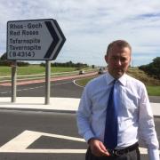 WHERE’S PENDINE?:  Simon Hart MP at the Red Roses junction off the new by-pass.  He and the community council are working together to improve signage and safety at the junction. (9389123)