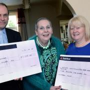 Monica Thomas (centre) presents the money raised from her headshave to the Rev Kingsley Taylor of St Mry's Church, Whitland and Sue Ruddock of the Morriston Hospital Neuro Inflammatory Team. PICTURE: Gareth Davies Photography (22471439)