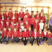 Full attendance during the Easter term for these Stepaside CP School pupils, pictured with headteacher Paul Harries.