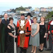 Tenby's new mayor, Councillor Laurence Blackhall, is pictured with town clerk Andrew Davies, chaplain Canon Andrew Grace, deputy mayor Sue Lane, mace bearer John Morgan, mayoress Samantha Skyrme, deputy mayoress Sian Waters and town crier Teifion
