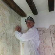 Peter Martindale works on the wall paintings conservation project at the Tudor Merchant’s House. PICTURE: National Trust.