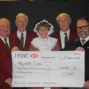 CONCERT organisers Gwynlais and Mary Phillips present the cheque for £3,562 to Ian Gravell, representing the Pembrokeshire Friends of Prostate Cymru. Pictured with them are Cor Meibion de Cymru members Len Jones and Steve Stephenson.