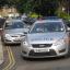 Police near an address in Ealing, west London, where a 32-year-old man was killed in a shooting