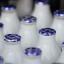 The Co-op has increased the premium it pays to its suppliers for their milk following protests by dairy farmers