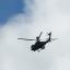 An Apache attack helicopter taking part in Operation Winged Hussar is pictured over Merlins Bridge  PIC: Jo Sayers