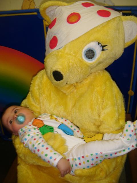 Three month old Maxi Rodrigues has a cuddle with Pudsey.