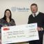 Laura Scowen (left) of the Teenage Cancer Trust with William McNamara OBE.