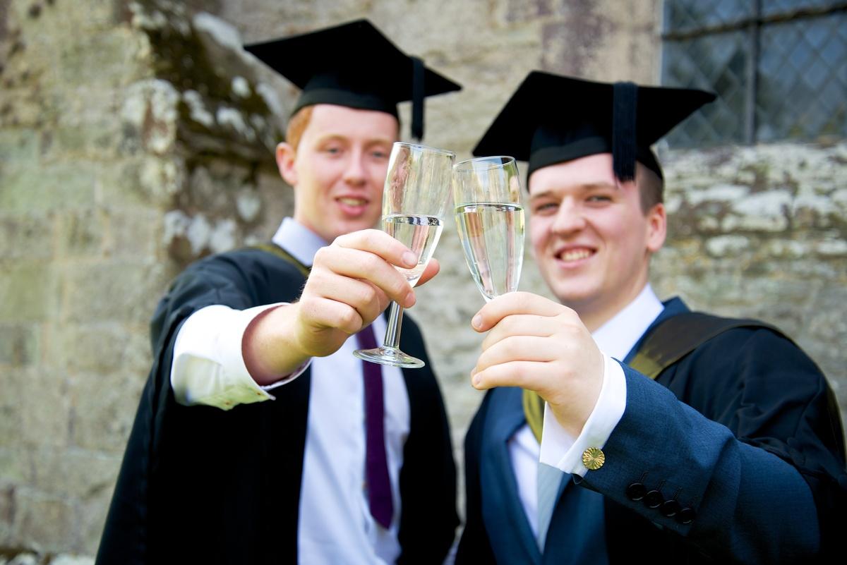 College students celebrate at their graduation ceremony