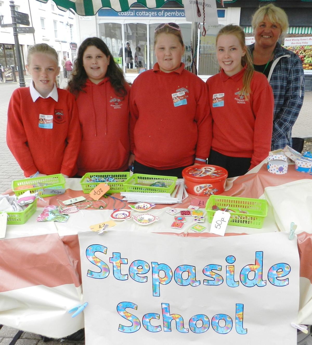 Year 6 pupils from Stepaside School were selling items including decorated boxes, friendship bracelets and painted tiles and tea bag stands on their stall.

