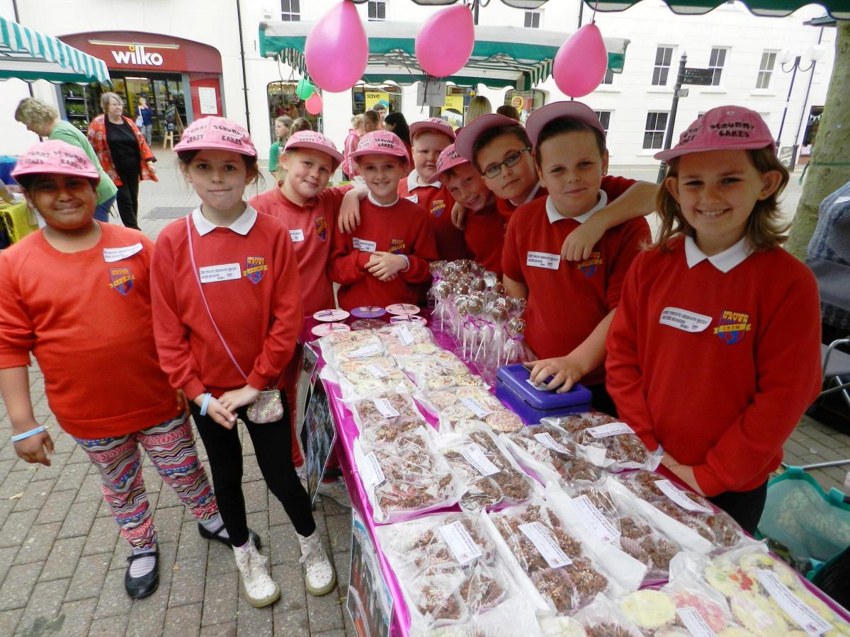 The Yummy Scrummy Crazy Cake Company from Milford Haven Junior School looked very professional with their pink branded  baseball caps and special cakes and labels. 
