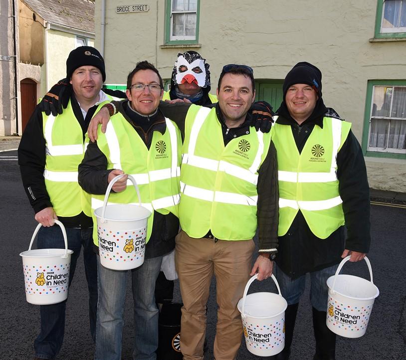 Fishguard and District Round Table members braved the blustery weather last Friday to hold their annual bridge collection in Lower Town. 
PICTURE: Johnny Morris