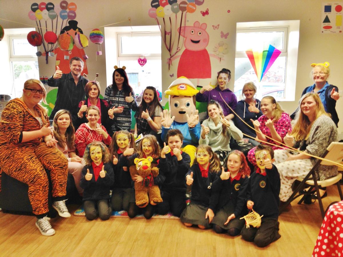 Children at Cardigan's Jig-So Centre were joined in their fundraising activities by BBC Radio Wales reporter Jason Phelps who was broadcasting live from the centre.