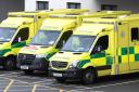 General photo of Welsh Ambulance Service Trust ambulance vehicles at a hospital.