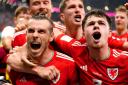 Gareth Bale, left, celebrates scoring Wales' equaliser in their 1-1 World Cup draw against the United States